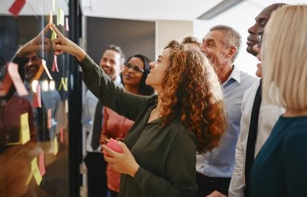 Group of diverse leaders reviewing strategy map